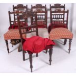 A harlequin set of 7 Edwardian mahogany dining chairs ( 4 + 3 ) all with similar carved back rests,