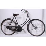 A good vintage Ladies loop frame Raleigh bicycle bike with original leather saddle.