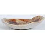 A 20th century studio pottery drip glaze fruit bowl having abstract design bearing unsigned W36cm