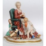 A large Capodimonte figure group titled Hide and Seek,