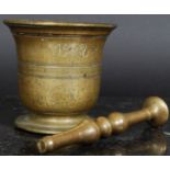 A 19th century bronze pestle and mortar,