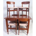 A retro 1960's set of 6 propeller back dining chairs together with the matching draw leaf extending