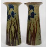 A pair of fat lava / studio pottery style vases having flared rims, Iris decoration.