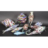 A large quantity of coloured Murano glass fish of various shapes and sizes.