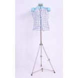 A Twin fit adjustable dress makers dummy on an adjustable tripod stand. H170 cm tall.