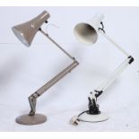 A retro Herbert Terry anglepoise lamp in brown along with another of similar form. 90 cm tall.