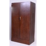 A 1930's Art Deco oak Compactom wardrobe.