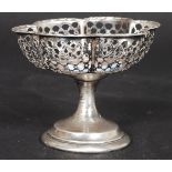 A silver hallmarked fret pierced raised bon bon dish tazza bearing hallmarks for 1910 Birmingham