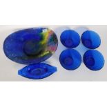 A collection of blue glass to include a pressed studio glass fruit bowl an d others please see