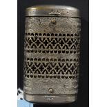 A Victorian stamped metal vesta handwarmer combination of lozenge form with fret worked centre
