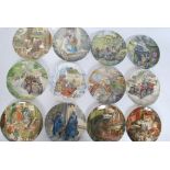 A quantity of Wedgwood Wind in the Willows collectable plates ( see illustration ) H21cm