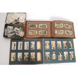A collection of assorted cigarette cards