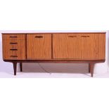 A retro Melamine sideboard having a bank of four drawers and shelved cupboard space.