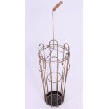 A vintage 1950's stick / umbrella stand in the form of an umbrella in wire work construction.