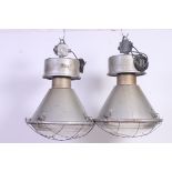 A pair of vintage Zaklady Metalow Industrial large factory pendant lights complete with the glass