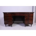 A vintage twin pedestal oak office desk with drawers to the pedestal.