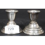 A pair of late Victorian silver hallmarked stub candlesticks with illegible marks likely 1900 ( see