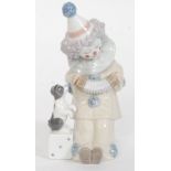 A Lladro figurine ' Pierrot with Concertin ' Model No 5279 impressed factory marks to base,
