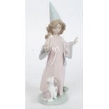 A Lladro figurine ' Under My Spell ' model no 6170 by sculptor Antonio Ramos, issued 1994,