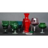 A collection of studio glass to include oversized brandy glass, coloured glass and other pieces.