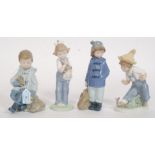 A collection of 4 Nao by Lladro figurines to include Boy with Rabbit & Bag, Girl Standing With Bag,