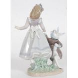 A Lladro figurine ' Alice in Wonderland ' Impressed factory marks 5740 to base also bearing  blue