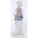 A Lladro figurine ' Going Fishing ' Bearing impressed model  No 4809 with blue stamp to base.