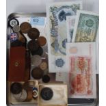 A collection of coins, foreign banknotes, a sterling maple leaf brooch,