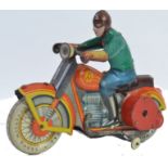 TINPLATE; An original vintage tinplate Russian made clockwork motorcycle and rider.