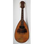 An early 20th century pear shaped bowl back mandolin ( Musical Instrument )  having paper label to