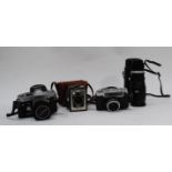 A collection of vintage cameras to include a Yashika Minister-D.