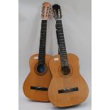 A Burswood six string accustic guitar along with another six string Spanish accustic guitar.