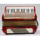 A cased Hohner Arietta 11m Accordion complete with the straps.