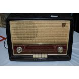 Vintage Philip's Bakelite cased valve radio, dials and switches to front.