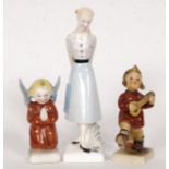 Two Hummel china figurines, along with a