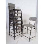 A set of 6 retro school / industrial stacking laboratory chairs - dining chairs raised on tubular