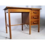 A 1940's golden oak Air Ministry style clerks desk raised on squared legs with pedestal of drawers