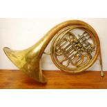 A late 19th early 20th century brass French horn, inscribed ALLIANCE J.R.