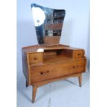 A 1950's oak Ernest Gomme / G-Plan  dressing table chest having shaped mirrors over drawers all