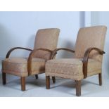 A pair of 1930's Art Deco bridge armchairs having bentwood shaped elbow rests with upholstered