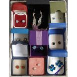 A collection of 9x silver and white metal 925 ladies earrings. Each within a presentation box.