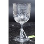 A fine Edwardian crystal glass having etched decoration with cut glass stem on terraced base.