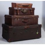 A stack of vintage suitcases of graduating size dating to the 20th century  ( see illustrations ).