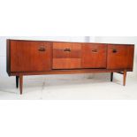 An excellent Danish teak wood 1970's sideboard raised on angular tapered legs with a series of