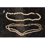 Two sets of pearls - one marked ' silver ' to the clasp