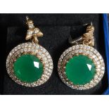 A pair of large ladies cz and real emerald earrings