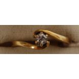 An 18ct gold and single stone diamond ring being suspension set having central diamond approx 15pts.