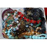 A box of assorted costume jewellery to include bracelets, necklaces etc.
