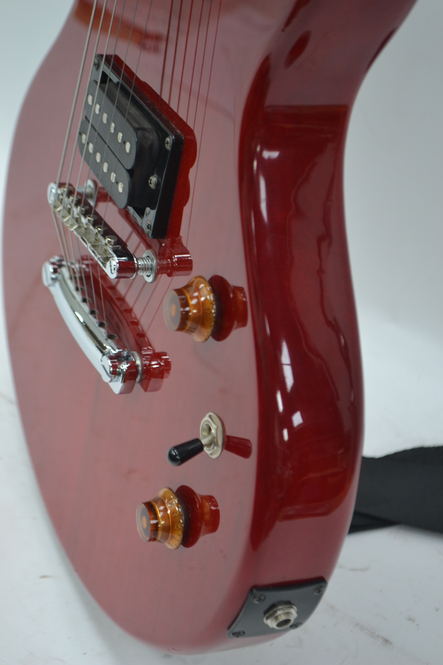 A Rockwood by Hohner Gibson style solid body electric guitar in red, with case.