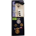 A collection of medals to include Edward VII Coronation Hospital fund metals and brooches together